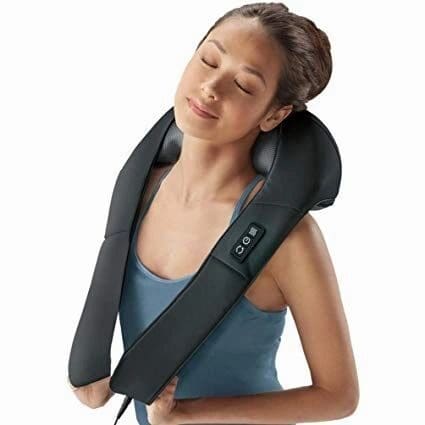 A girl putting a machine on her neck
